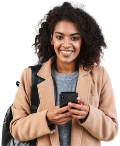 Woman smiling, holding phone, wearing backpack